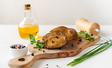 Seitan stakes with spices, olive oil, fresh leek on cutting board