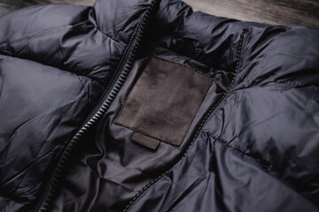 Blank clothing label on fabric texture. Clothing label with place for text.