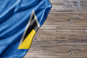 Wooden pattern old nature table board with Saint Lucia flag - 485402837