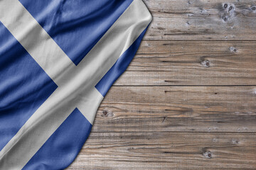 Wooden pattern old nature table board with Scotland flag - 485402845