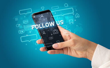 Hand using smartphone with social media concept
