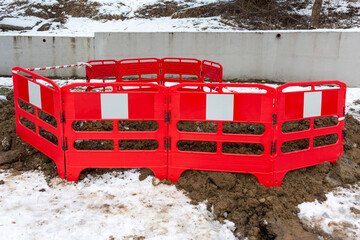 emporary restrictive fence around the breakthrough of the heating main, water supply for the time...