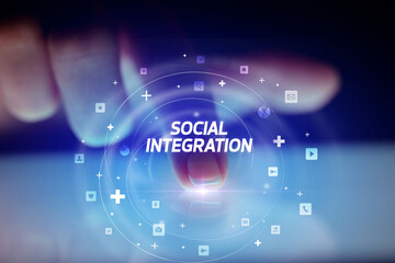 Finger touching tablet with social media icons concept