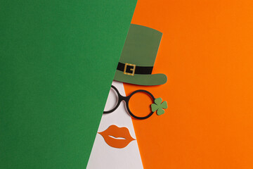 Happy St. Patrick's day background. Patrick day party props: leprechaun hat, glasses with lucky...