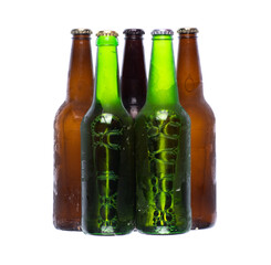 frozen glass beer bottles isolated on white background