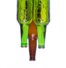 frozen glass beer bottles isolated on white background