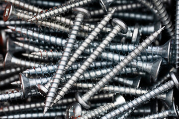 Close up of a pile of multipurpose metal screws