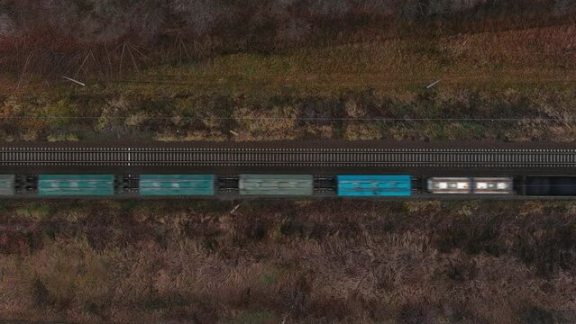 Freight trains and wagons of various kinds Aerial view from flying drone of colorful freight trains at the railway station. Wagons with goods by rail.