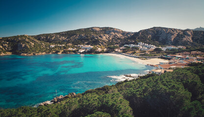Fototapeta na wymiar Beautiful Aerial view of Baja Sardinia village beach and sea, Costa Smeralda. Italy