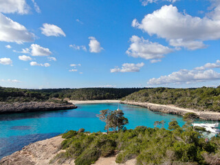 Fototapeta premium Cala Mandia. Beautiful view of the seacoast of Majorca with an amazing turquoise sea, in the middle of the nature. Concept of summer, travel, relax and enjoy 
