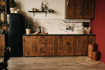 Rustic kitchen with wooden table and facades decorated for Christmas