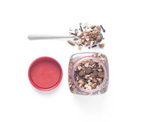Flat lay of mulling spices for mulled wine, cider or grog in glass jar and spoon