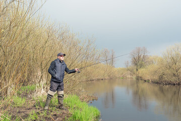 Fishing on the river bank.