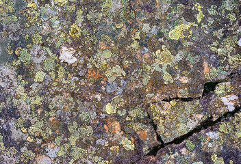 Texture of natural stone in abstract layers with colorful patterns. Natural background.