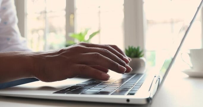 Woman hands working on laptop keyboard, close up cropped view. Busy female freelancer blogger typing text on wireless computer, lead blogging, remote distancing communication though e-mailing concept