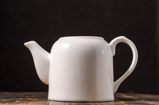 White empty porcelain teapot.
