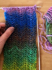hand knitting with a zigzag stitch pattern 