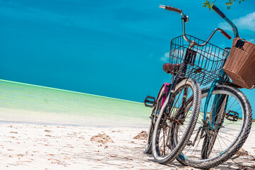 Turquoise bike parked at the beach, in the Mexican Caribbean