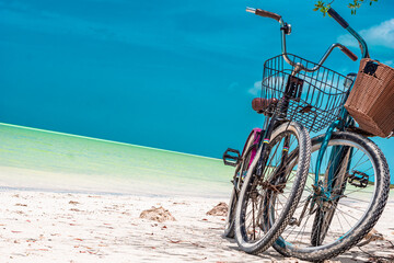 Fototapeta premium Turquoise bike parked at the beach, in the Mexican Caribbean