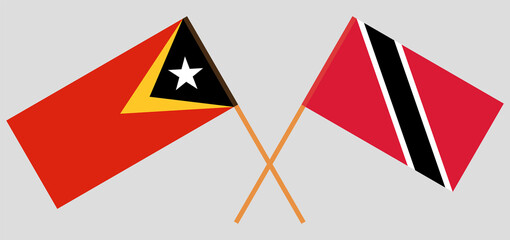 Crossed flags of East Timor and Trinidad and Tobago. Official colors. Correct proportion