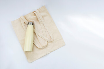 Reusable textile bag and metallic water bottle. Zero waste, sustainable living concept