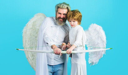 Valentines Day. Father and son angels with bow and arrow. Valentine cupid with white wings.