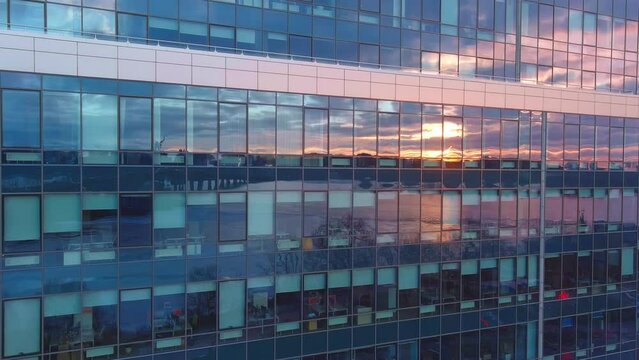Glass facade of a high-rise building in the business center. Construction and operation of the property. Facade glazing at height