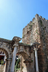 Hadrian's Gate - ancient triumphal arch located in Antalya, Turkey against blue sky