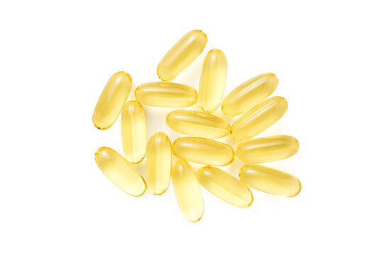 Heap of Omega 3 soft gel capsules isolated on white background