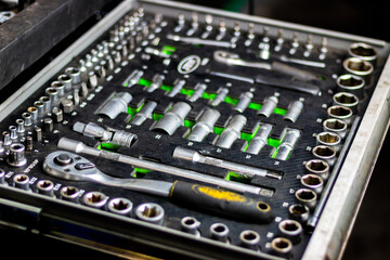 Set of the professional tools. Closeup of chrome wrench tools organized in box