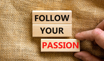 Follow your passion symbol. Concept words Follow your passion on blocks on beautiful canvas table canvas background. Businessman hand. Business, motivation and follow your passion concept. Copy space.