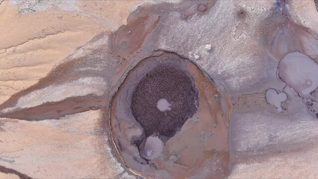 Aerial footage from drone with muddy volcano from Romanian mountains , Buzau county , Carpathian mountains , aerial landscape ,Paclele mici and Paclele Mari , vulcanii noroiosi 