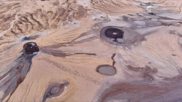 Aerial footage from drone with muddy volcano from Romanian mountains , Buzau county , Carpathian mountains , aerial landscape ,Paclele mici and Paclele Mari , vulcanii noroiosi 
