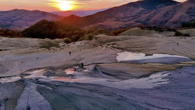 Aerial footage from drone with muddy volcano from Romanian mountains , Buzau county , Carpathian mountains , aerial landscape ,Paclele mici and Paclele Mari , vulcanii noroiosi 