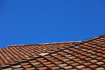 Terracotta tile roof and clear blue sky