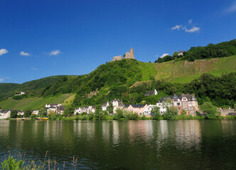 Fototapeta na wymiar View From The Mosel River To Fort Landshut In Bernkastel-Kues Germany On A Beautiful Sunny Summer Day With A Clear Blue Sky And A Few Clouds
