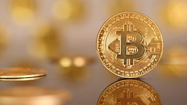 Slider shot revealing Bitcoin in gold coin setting. Close up.
