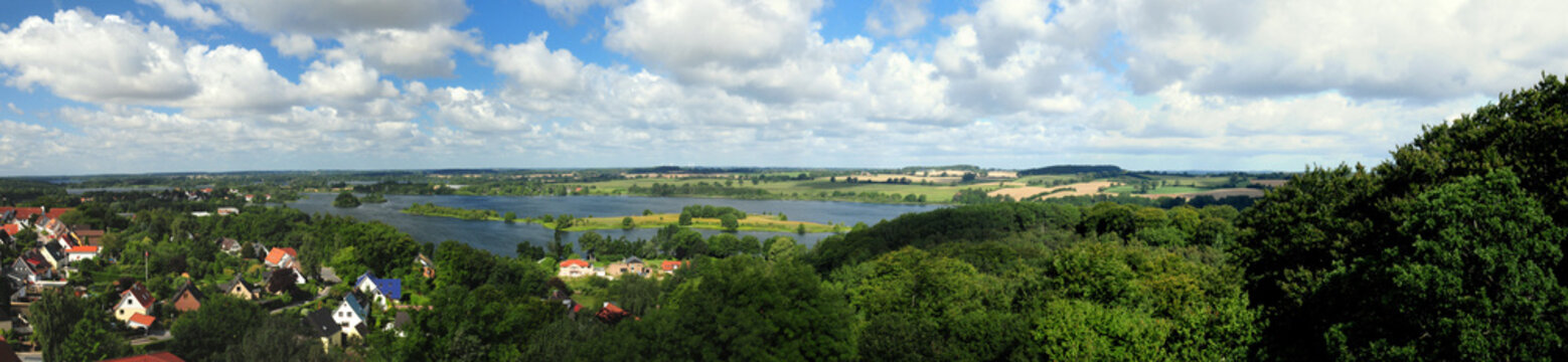 Panorama View from The Parnass Tower To The Lake Of Ploen Germany On A Beautiful Sunny Summer Day With A Blue Sky And A Few Clouds