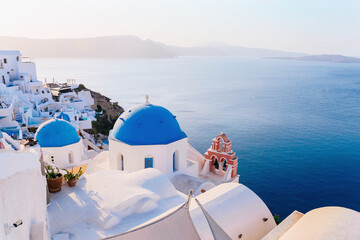 Fototapeta premium Beautiful view of Oia with traditional white houses, Santorini island, Greece
