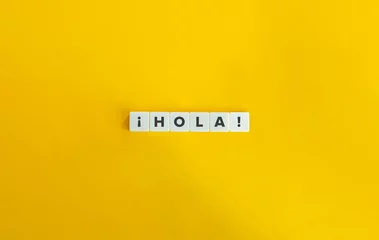 Foto op Canvas Hola word on letter tiles on yellow background. Minimal aesthetics. © photoopus