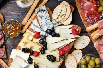 Сheese board with different types of Italian and French cheese gorgonzola parmesan brie or...