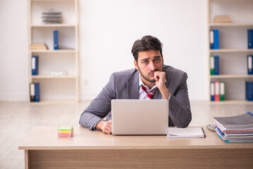 Young businessman employee working in the office