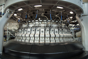 Colored top thread installed in automatic sewing or embroidery spinning machine producing thread, machines in textile factory.