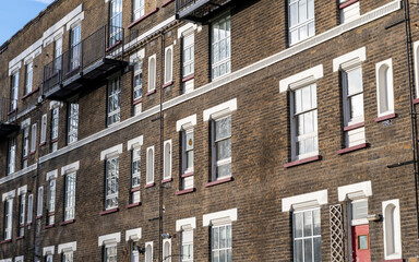 Obraz premium A dated terraced block of flats in the East End of London. UK. Originally built to house working class families.