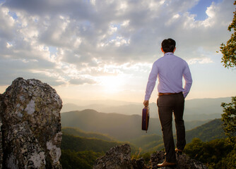 Concept vision, Young businessman wearing comfortable casual suit jacket standing holding business...