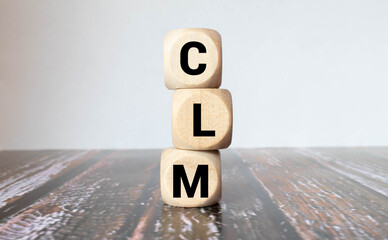 Business Acronym text CLM on wooden block. Conceptual image