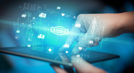 Close-up of a touchscreen with healthcare icons