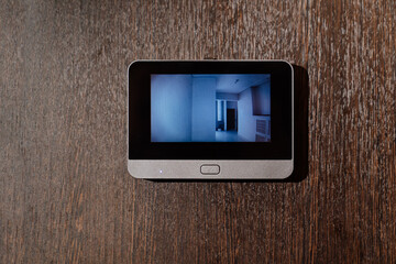 video screen of the peephole or intercom on the front door. 