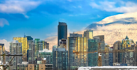 Vancouver, a beautiful with a blue sky behind a gorgeous and sexy cityscape. Travel to British Columbia see for your own eyes the magnificent lovely fantastic Lower mainland main City.