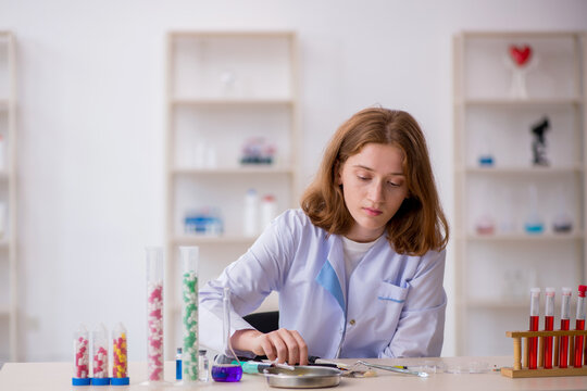 Young female chemist working at the lab